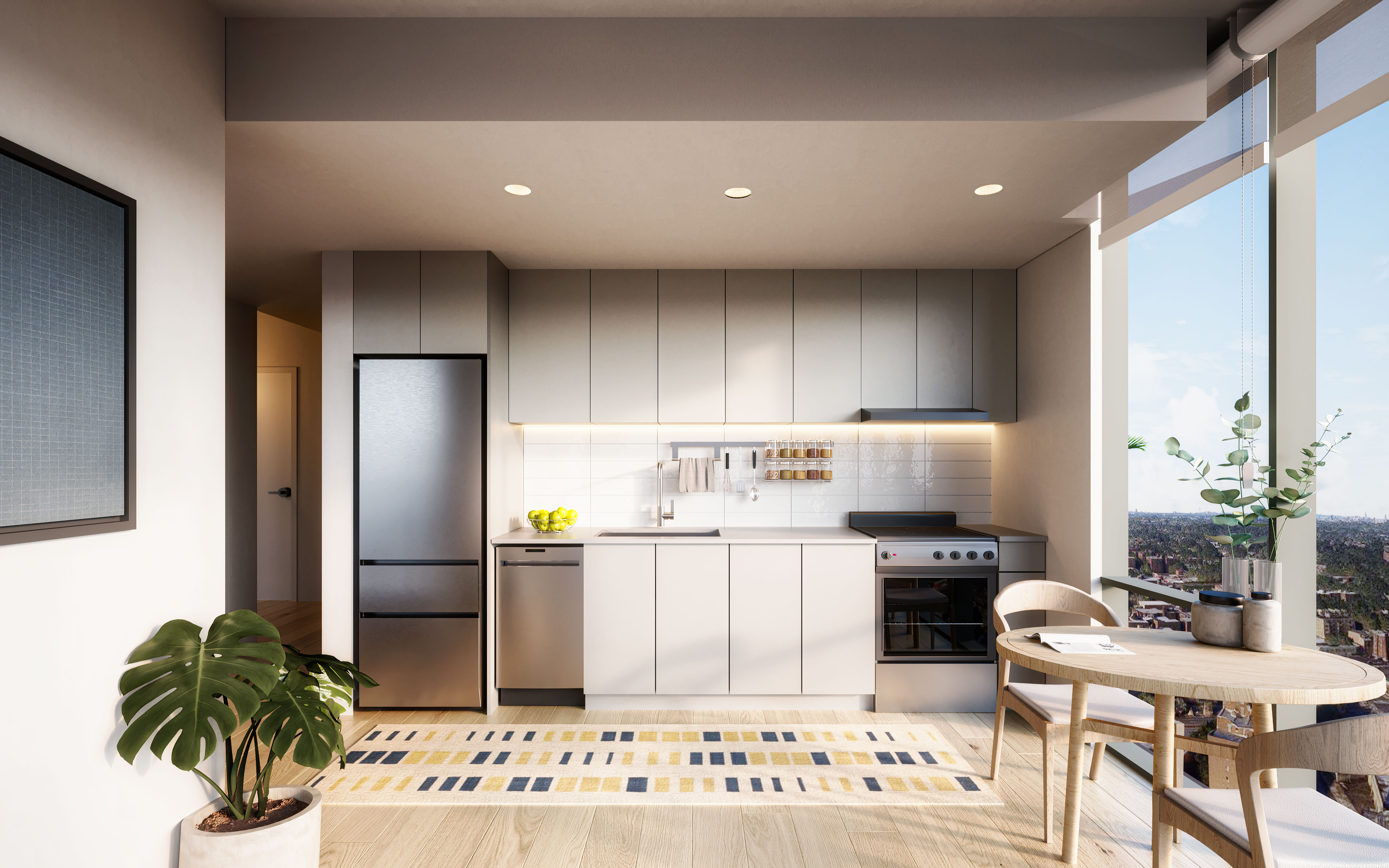 Modern kitchen w/ stainless steel appliances, table and huge windows offering NYC views at CORE Rego NYC new luxury rentals.