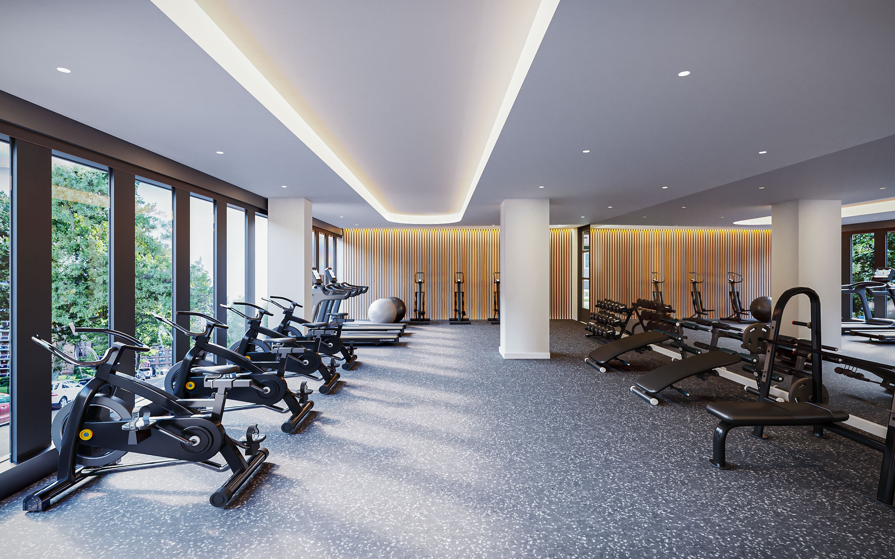 Fitness center amenity at CORE Rego Park apartments for rent in Queens with great views & ample equipments.