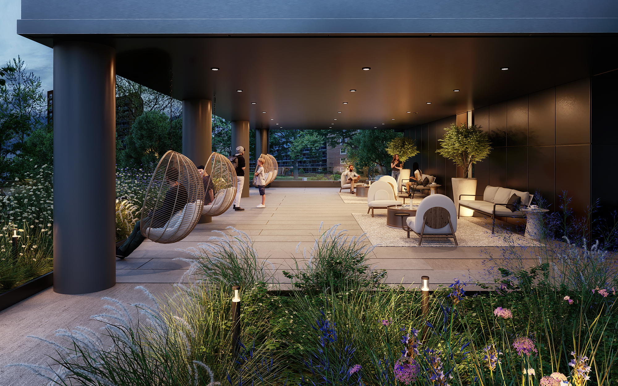 Outdoor terrace garden at CORE Rego Park apartments featuring residents enjoying egg swings, couches and flowers in bloom.